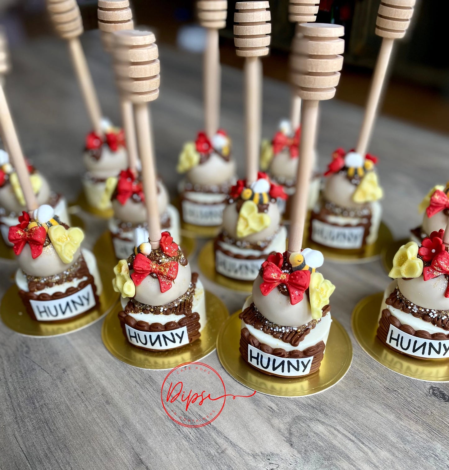 12 Hunny Pot Cake Pop/Oreo Combo treats with honey dipper sticks, Pooh Inspired honey pots, Winnie the Pooh hunny pots