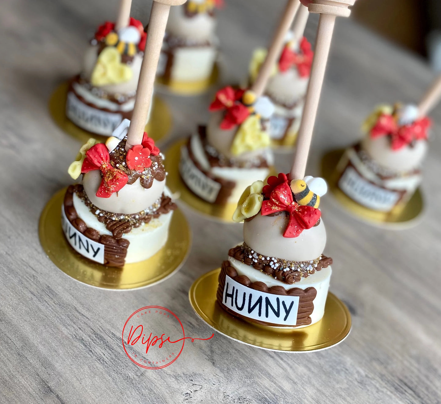 12 Hunny Pot Cake Pop/Oreo Combo treats with honey dipper sticks, Pooh Inspired honey pots, Winnie the Pooh hunny pots