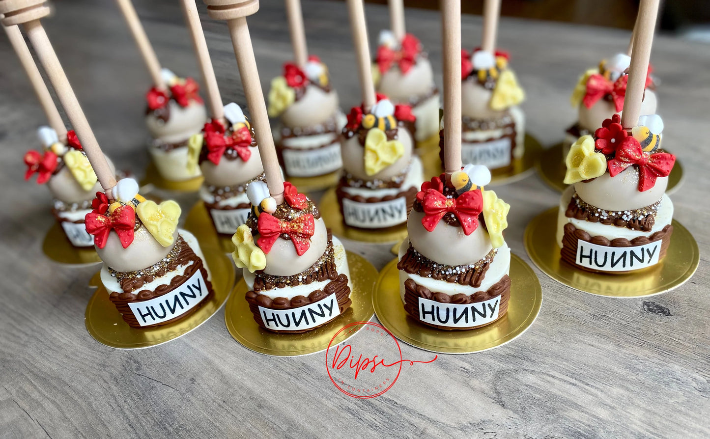 12 Hunny Pot Cake Pop/Oreo Combo treats with honey dipper sticks, Pooh Inspired honey pots, Winnie the Pooh hunny pots