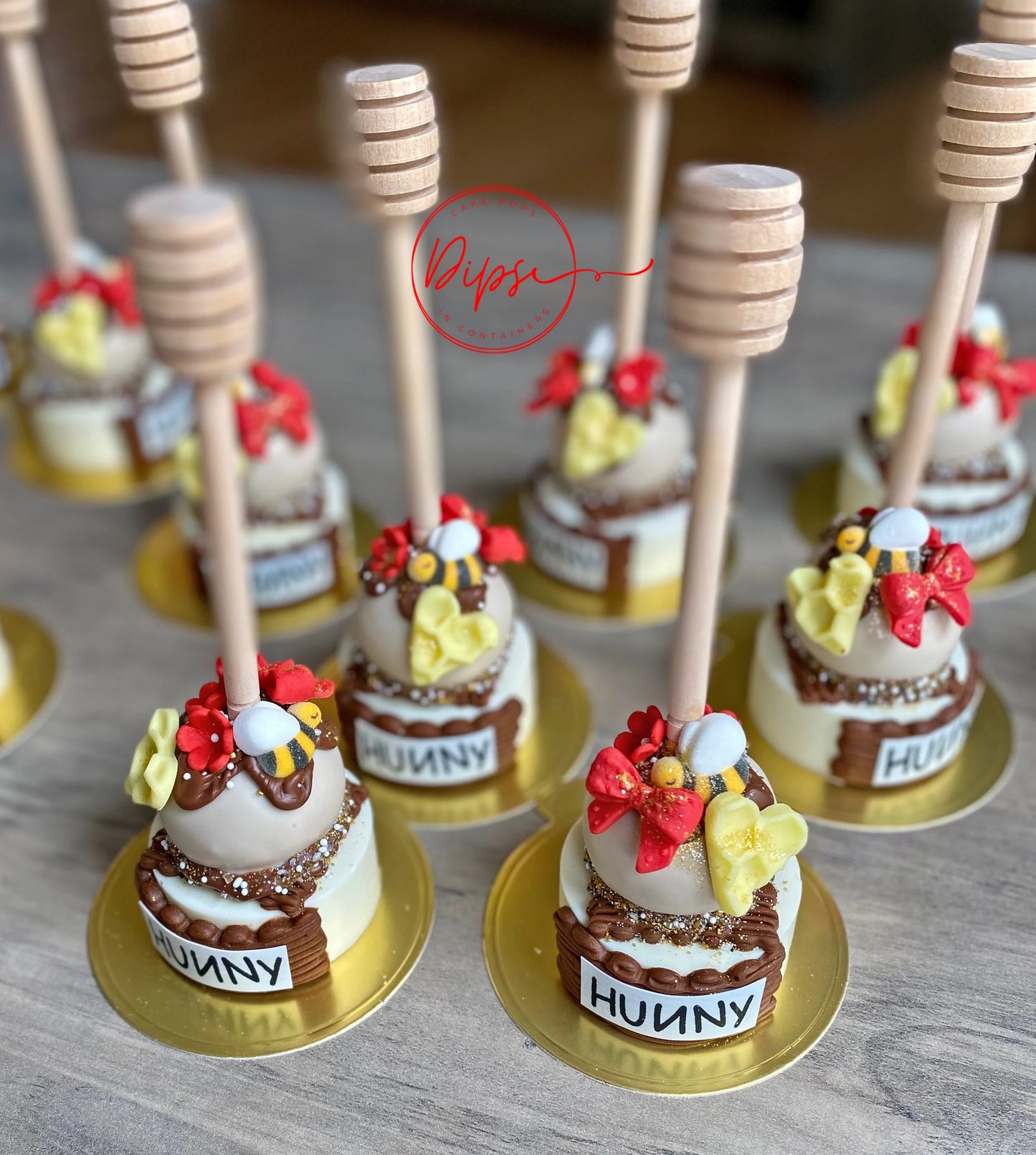 12 Hunny Pot Cake Pop/Oreo Combo treats with honey dipper sticks, Pooh Inspired honey pots, Winnie the Pooh hunny pots