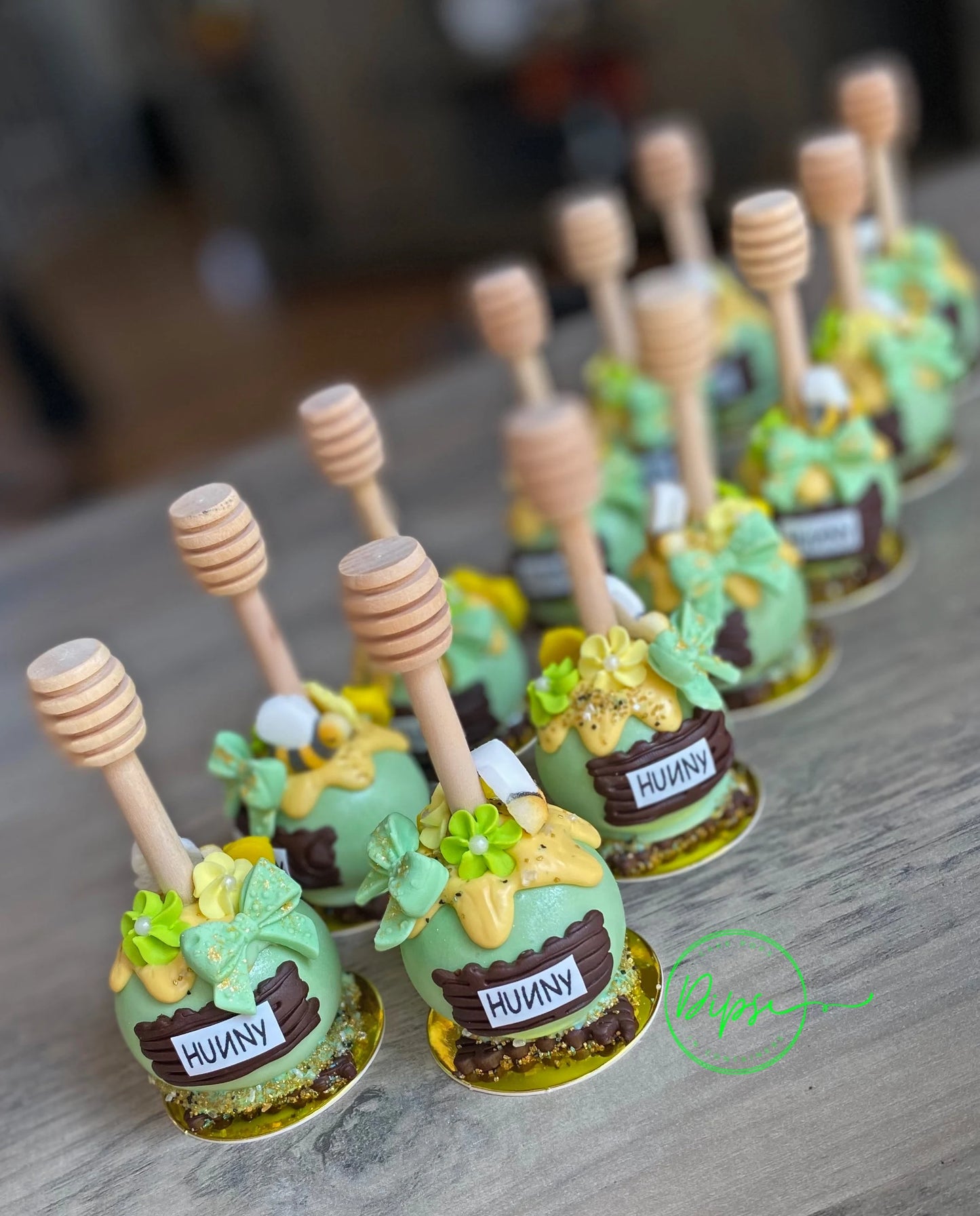 Hunny Pot Cake Pops with honey dipper stick,  Pooh Inspired honey pots, Baby shower cake pops