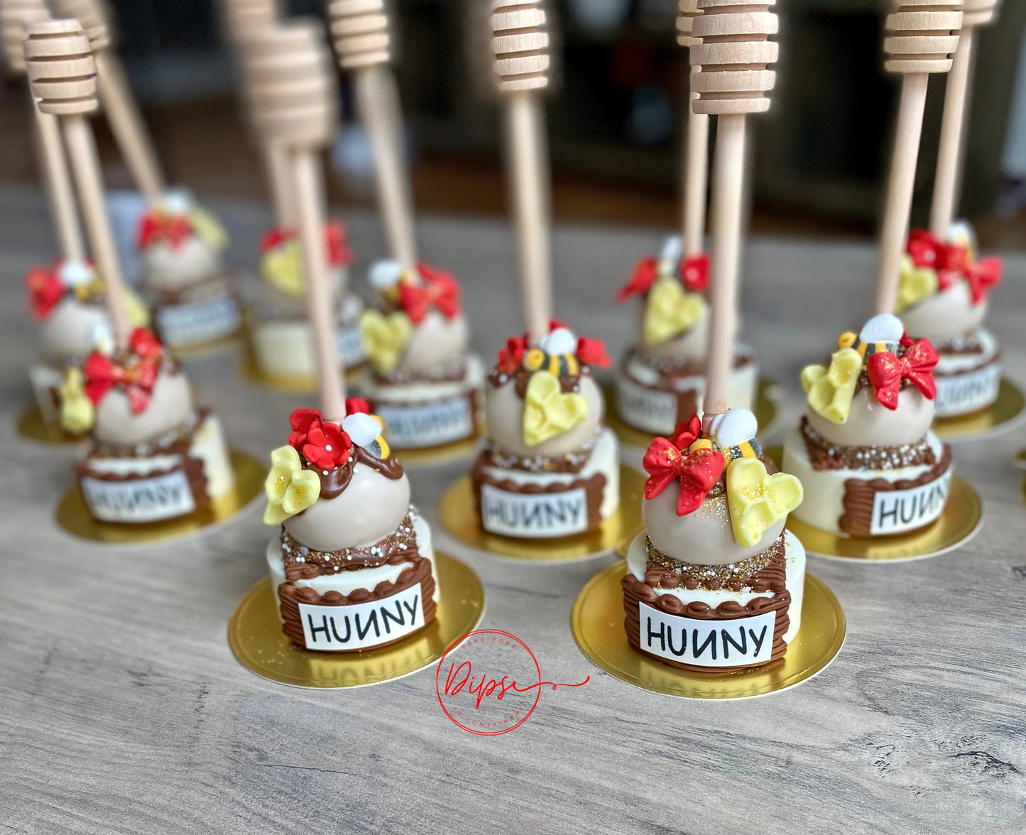 12 Hunny Pot Cake Pop/Oreo Combo treats with honey dipper sticks, Pooh Inspired honey pots, Winnie the Pooh hunny pots