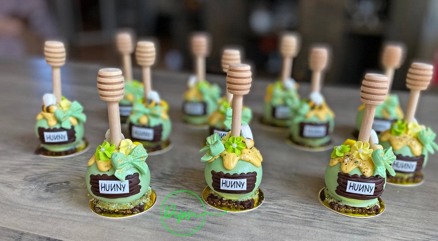 Hunny Pot Cake Pops with honey dipper stick,  Pooh Inspired honey pots, Baby shower cake pops