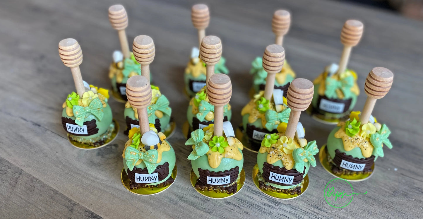 Hunny Pot Cake Pops with honey dipper stick,  Pooh Inspired honey pots, Baby shower cake pops