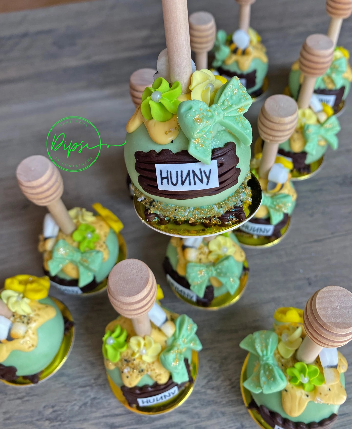 Hunny Pot Cake Pops with honey dipper stick,  Pooh Inspired honey pots, Baby shower cake pops